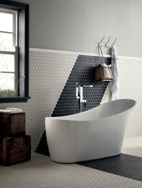 Geometric: hexagonal tiles create a monochrome arrow across this Fired Earth bathroom