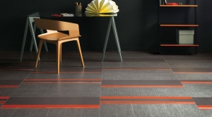 Cutting and sticking/ Amtico's Infinity Flare design uses strips of different floor tiles