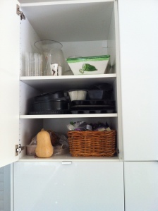 Non-fridge veg, nuts and dried fruit; bakeware; and vases at the top