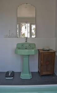 The basin and bath are unashamedly green in designer Luke Mortimer's home/ house tour by Design Sponge, 2012